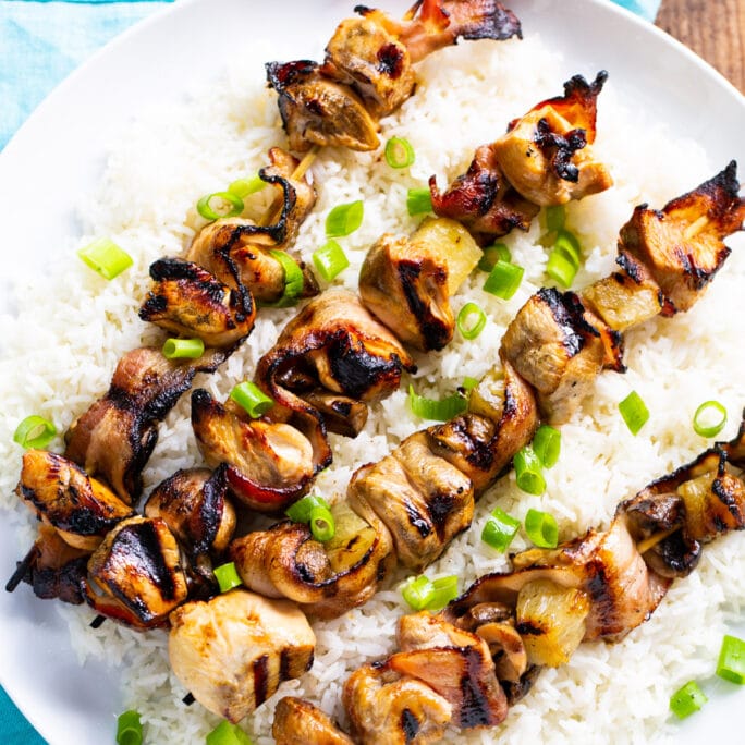 Chicken and Bacon Kabobs over white rice.