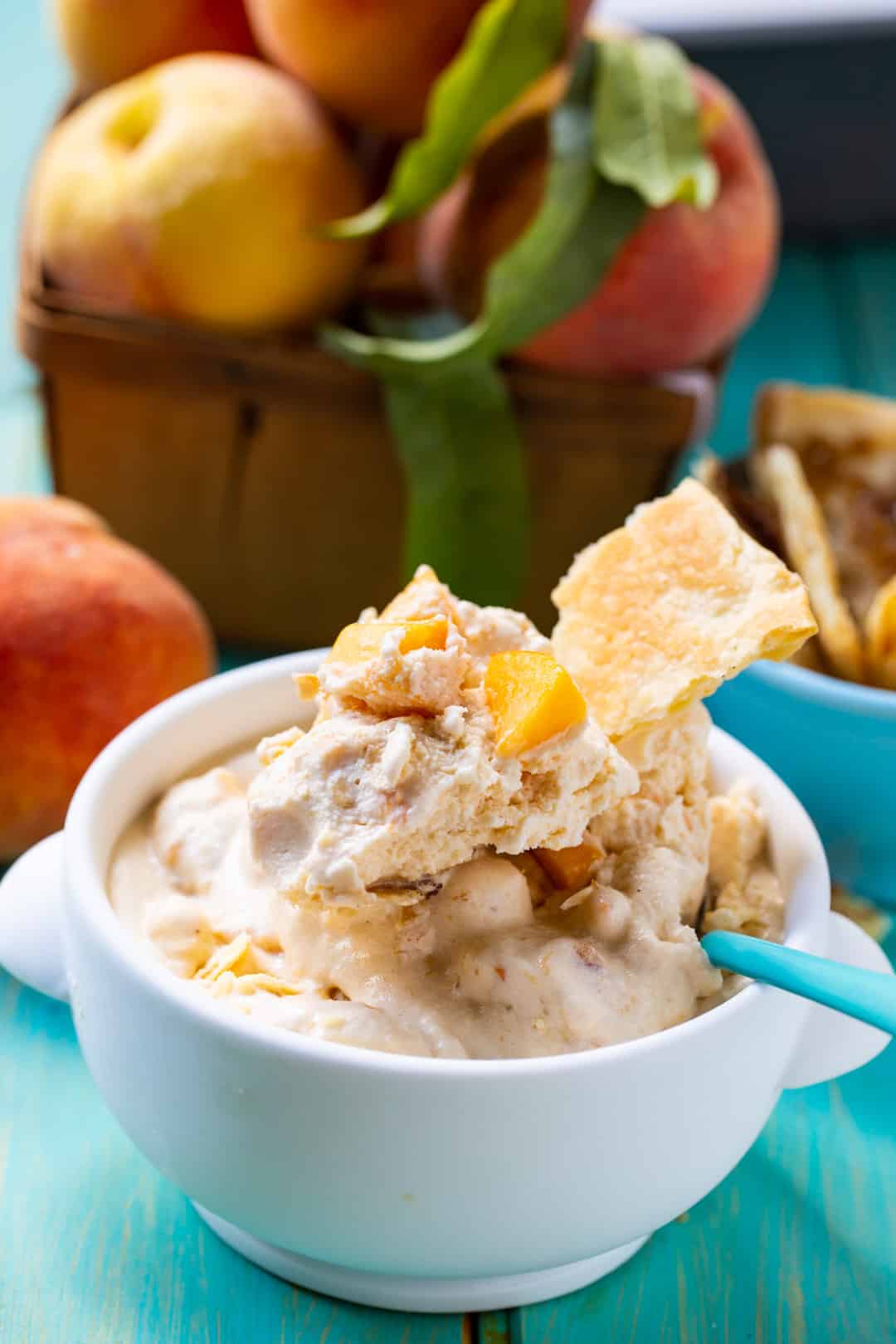 Peach Cobbler Ice Cream in bowl with spoon.