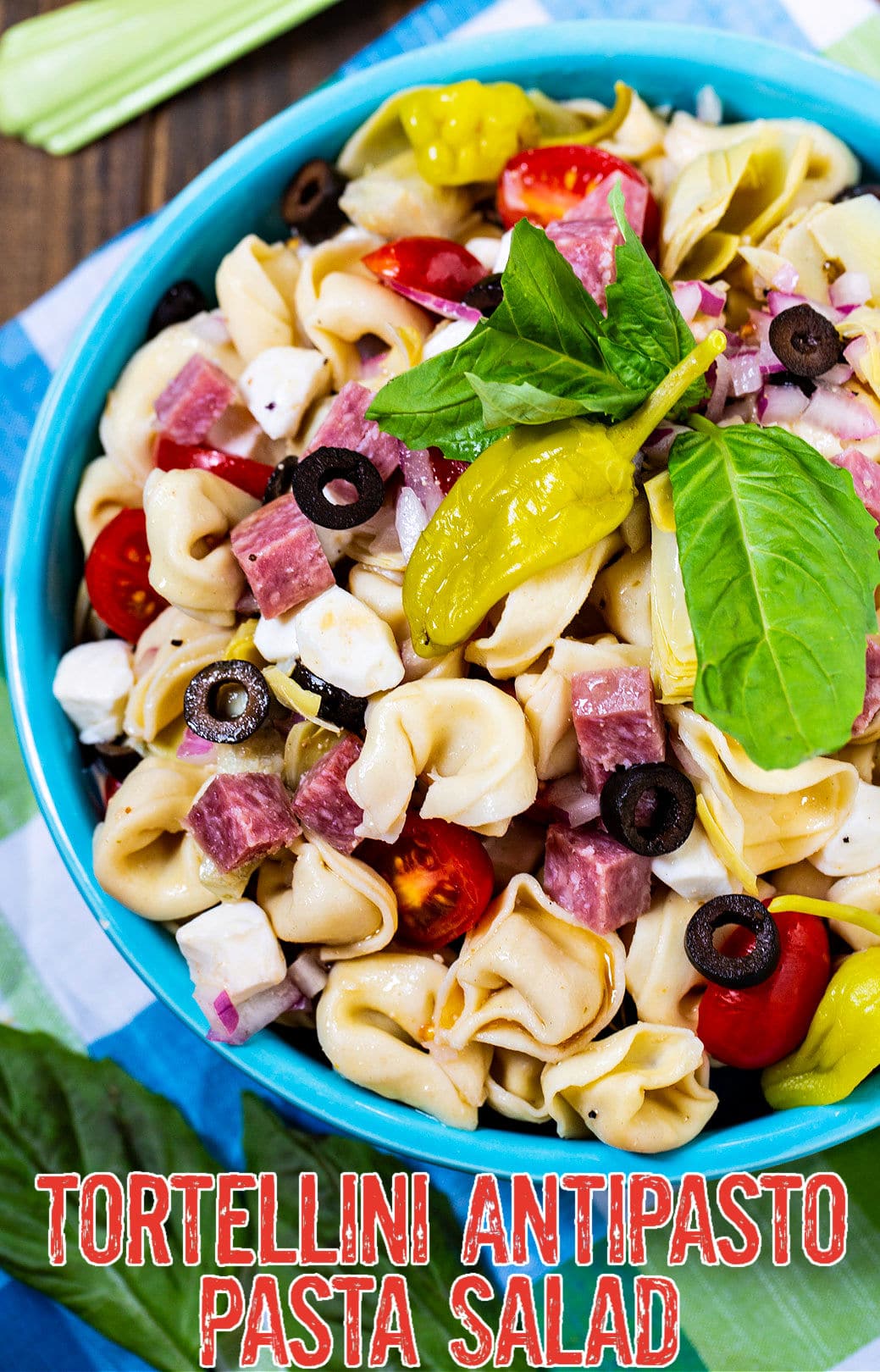 Tortellini Pasta Salad in blue serving bowl.