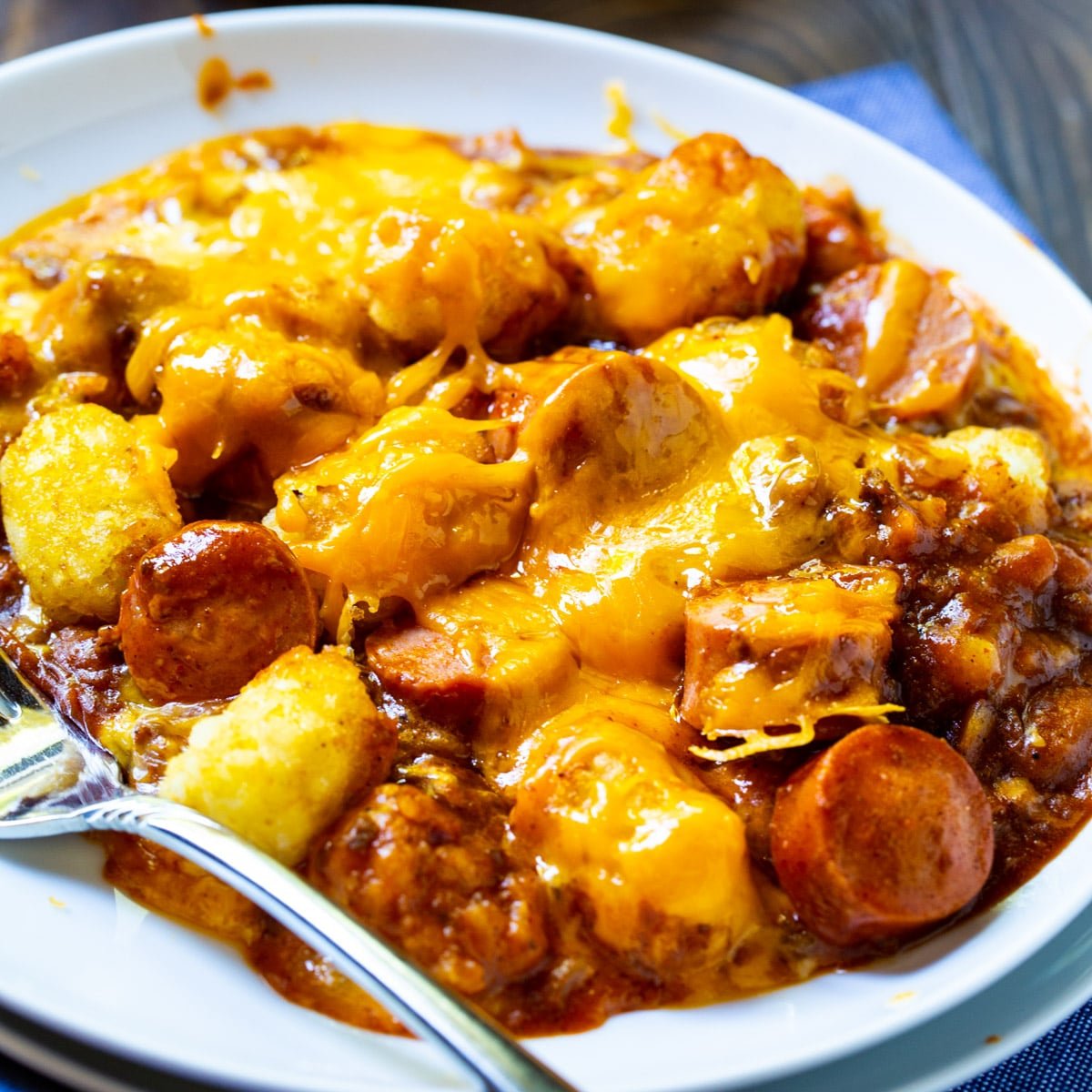 Cheesy Hot Dog Tater Tot Casserole dished up on a plate.
