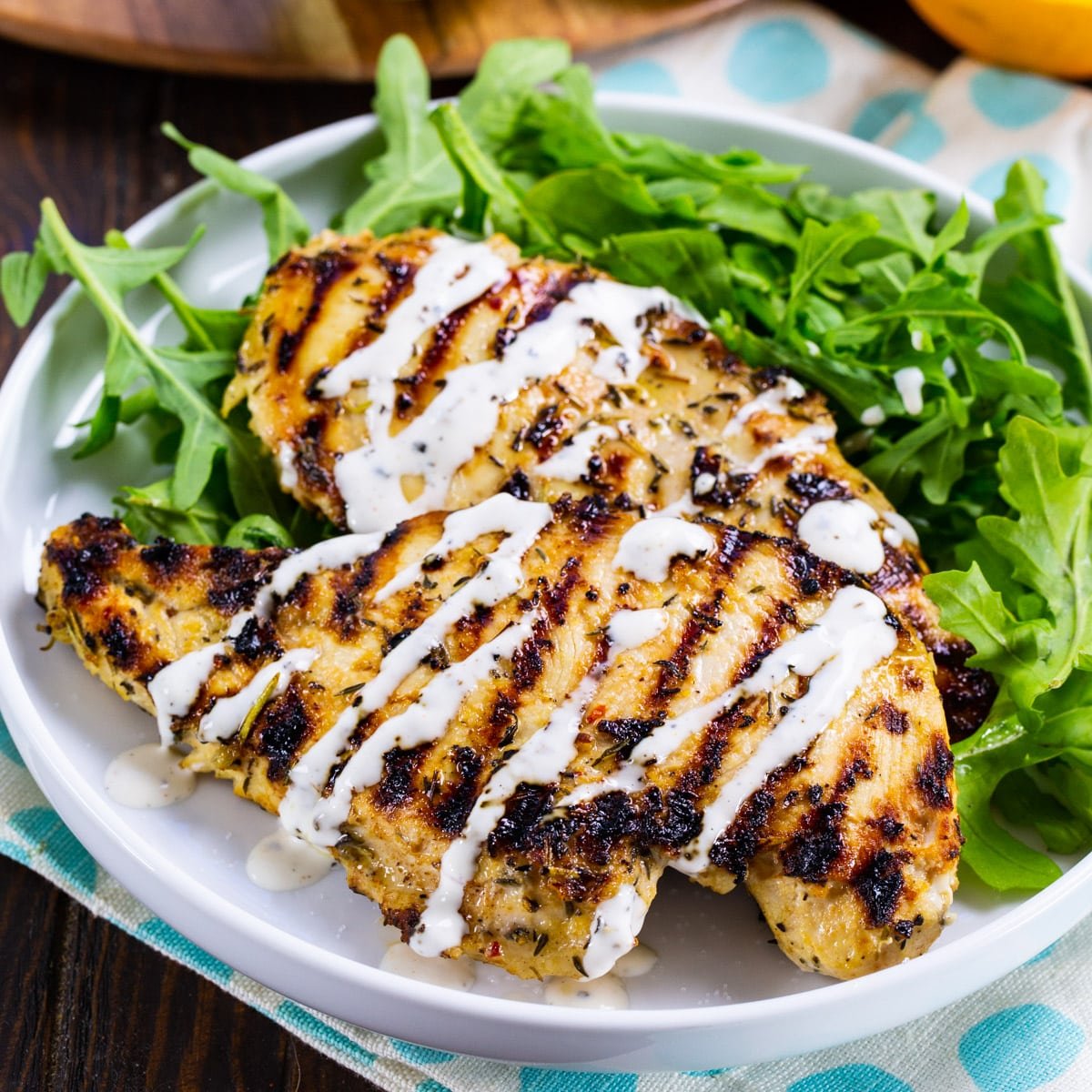 Grilled Citrus Chicken on plate with salad.