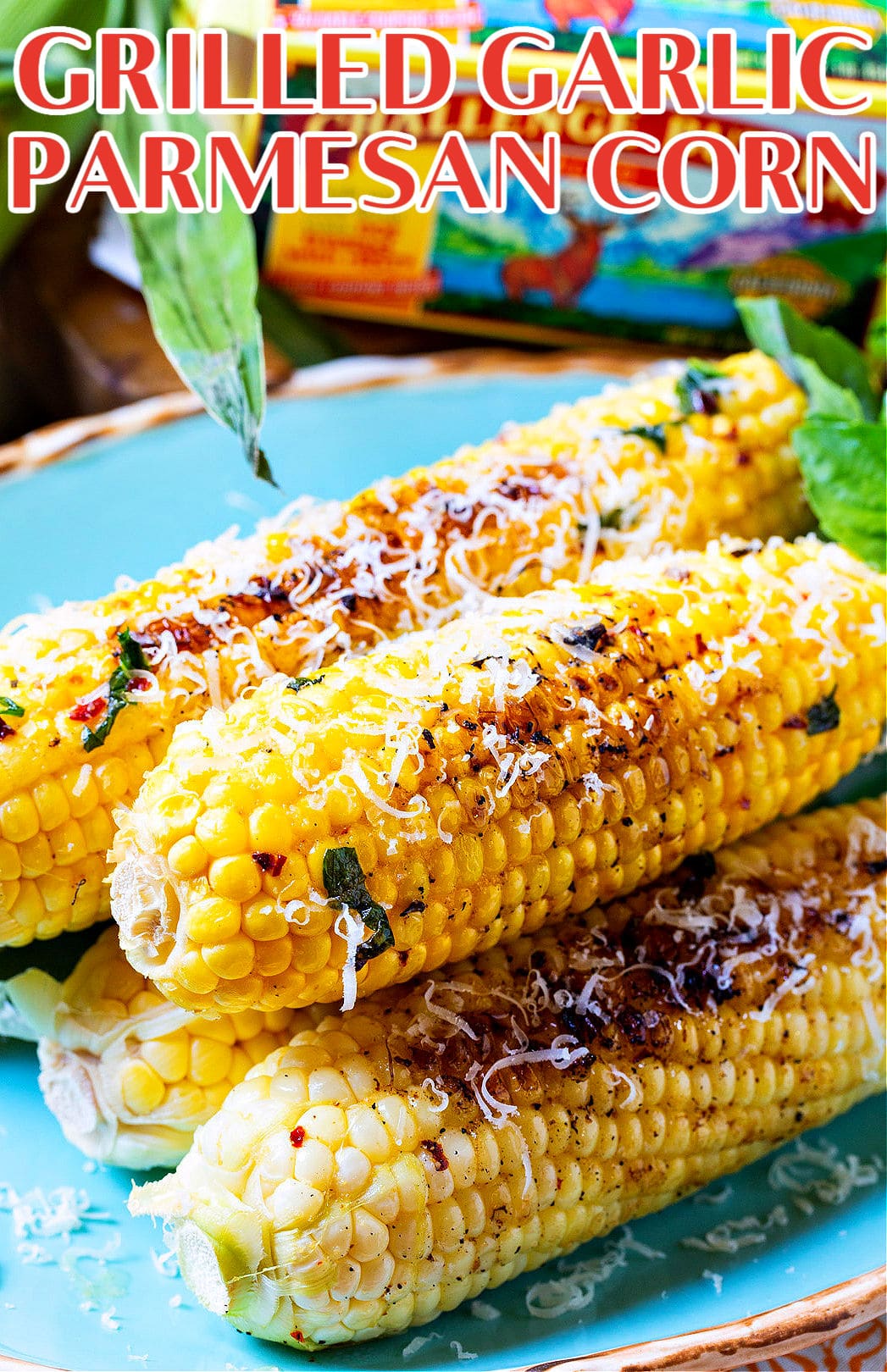 Grilled Garlic Parmesan Corn on a blue serving plate.