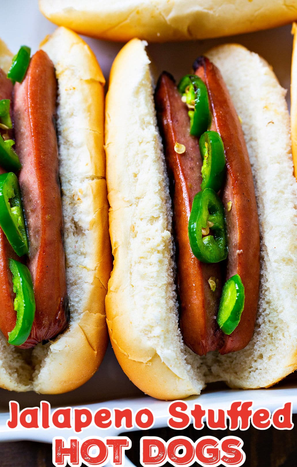 Jalapeno Stuffed Hot Dogs in buns.