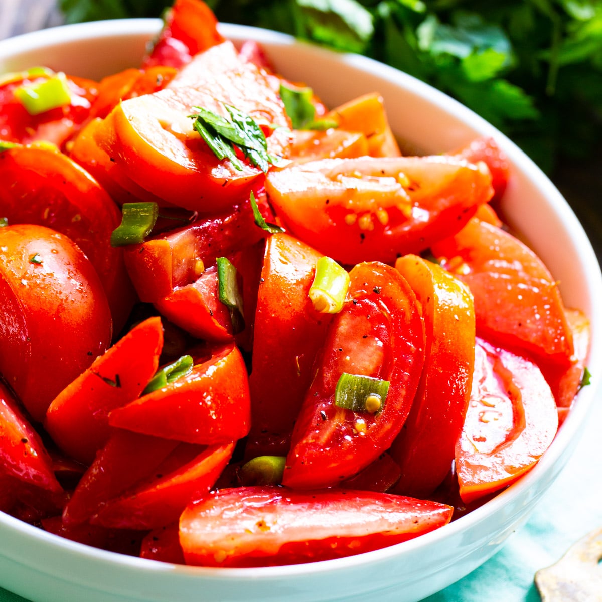 Marinated Tomatoes in a white bowl.