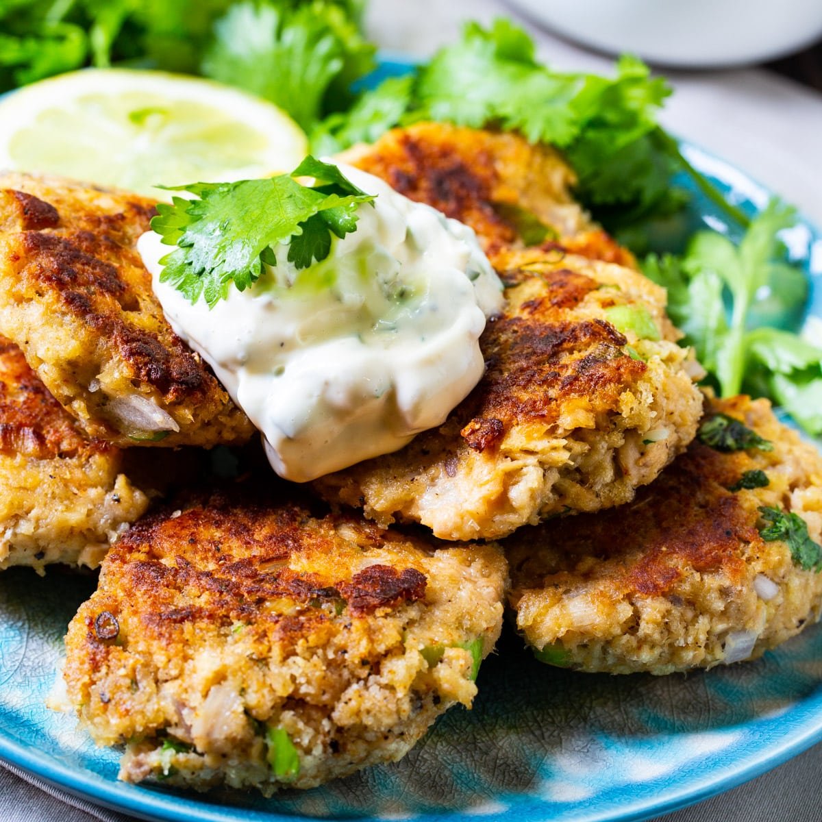 Salmon Croquettes with Cilantro Mayonnaise on a plate.