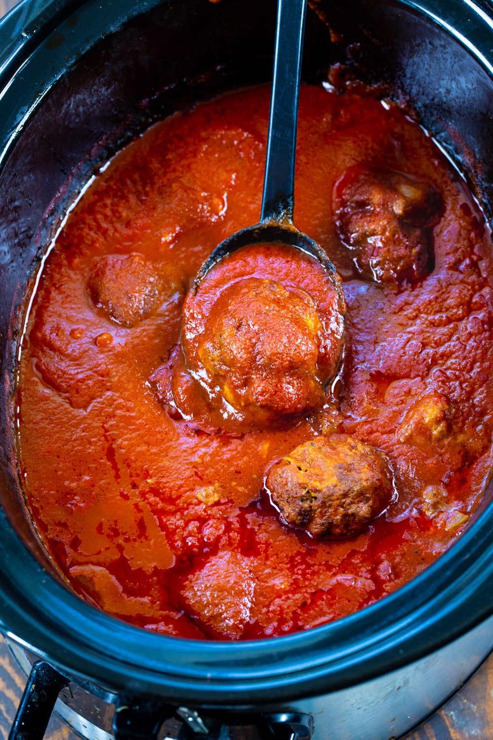 Spicy Meatballs and Sauce in a slow cooker.