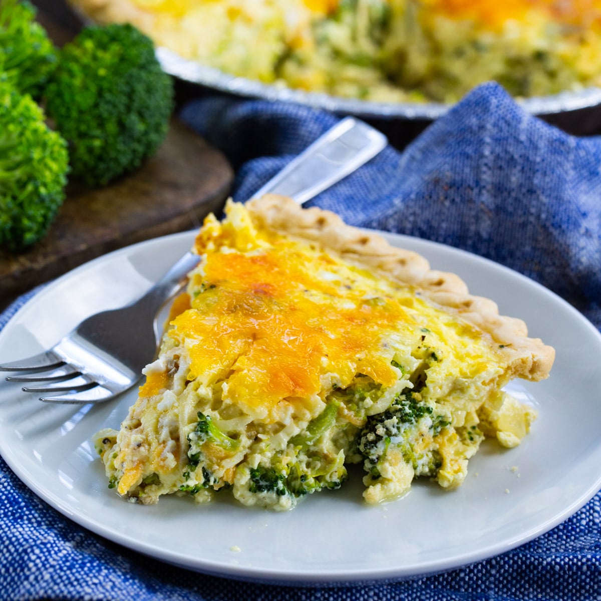 Slice of Broccoli Quiche connected  a plate.