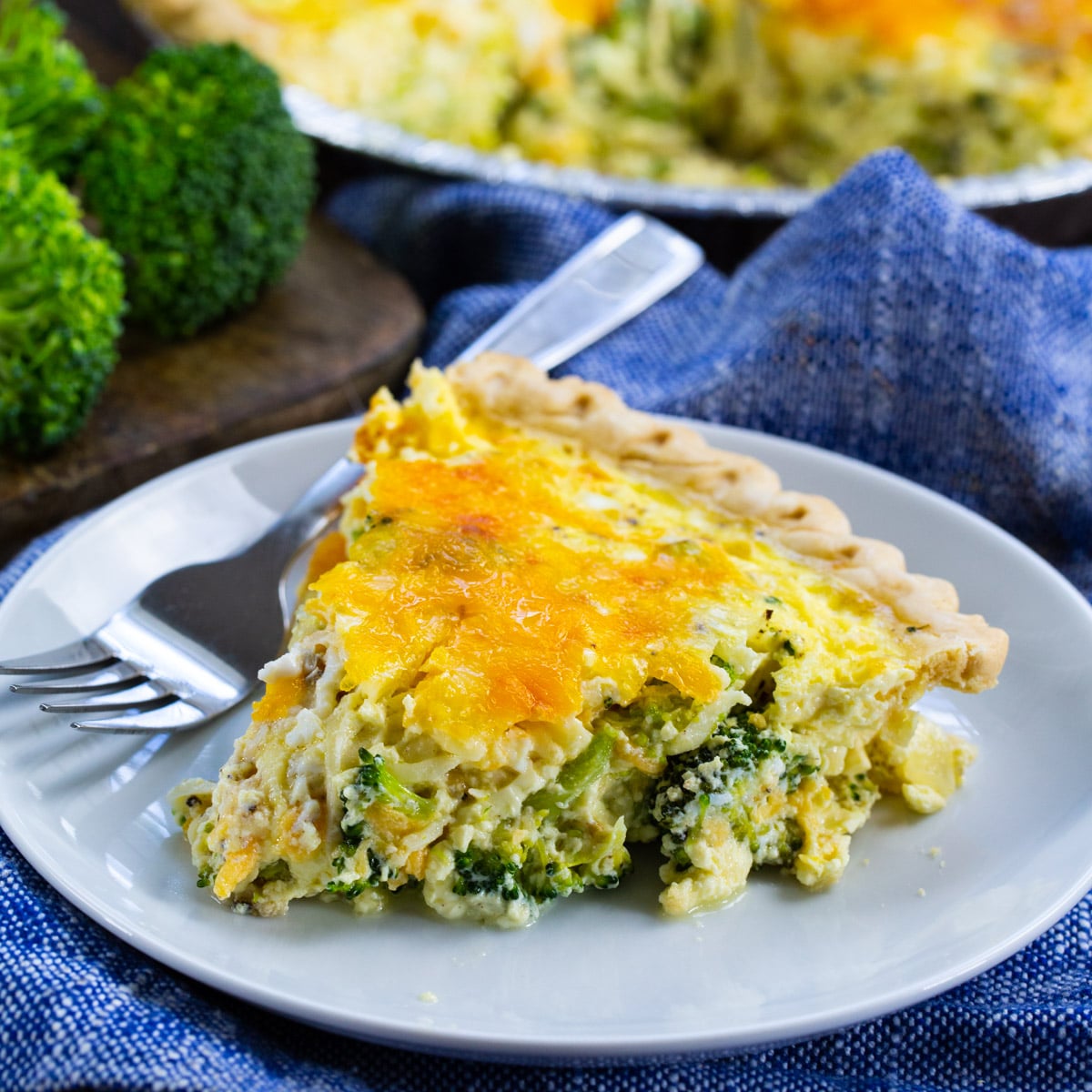 Slice of Broccoli Quiche on a plate.