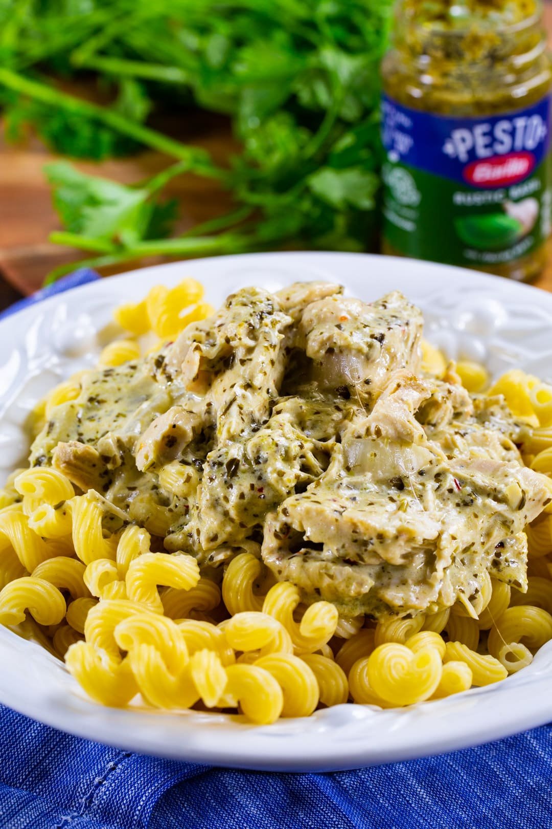 Creamy Pesto Chicken served over pasta.