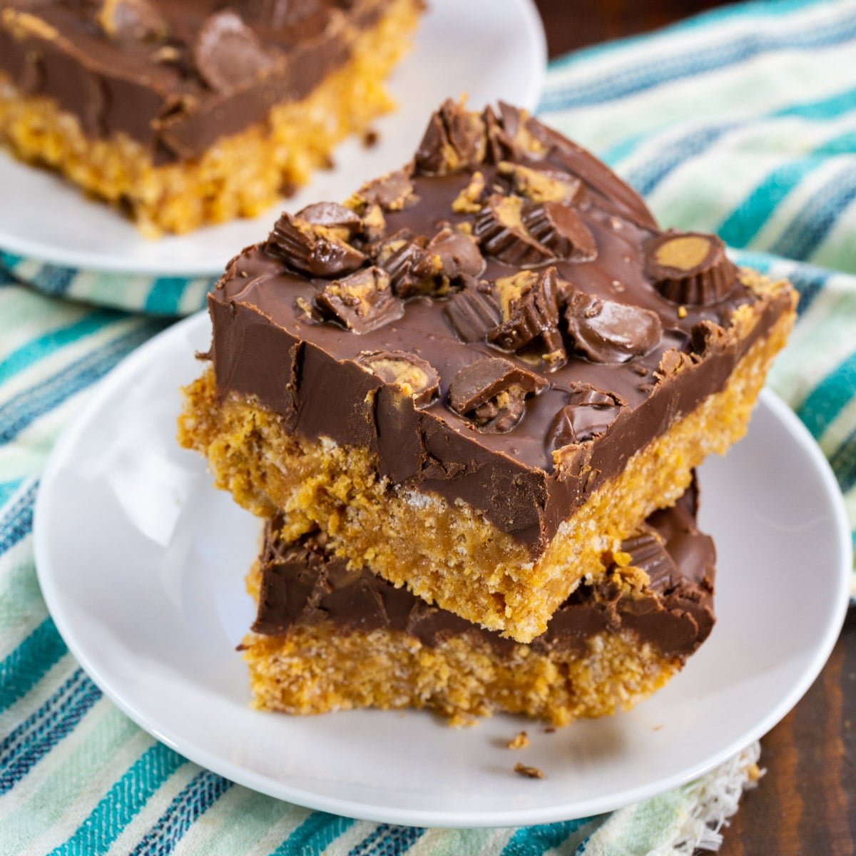 Two Chocolate Peanut Butter Rice Kripsie Treats on a plate.