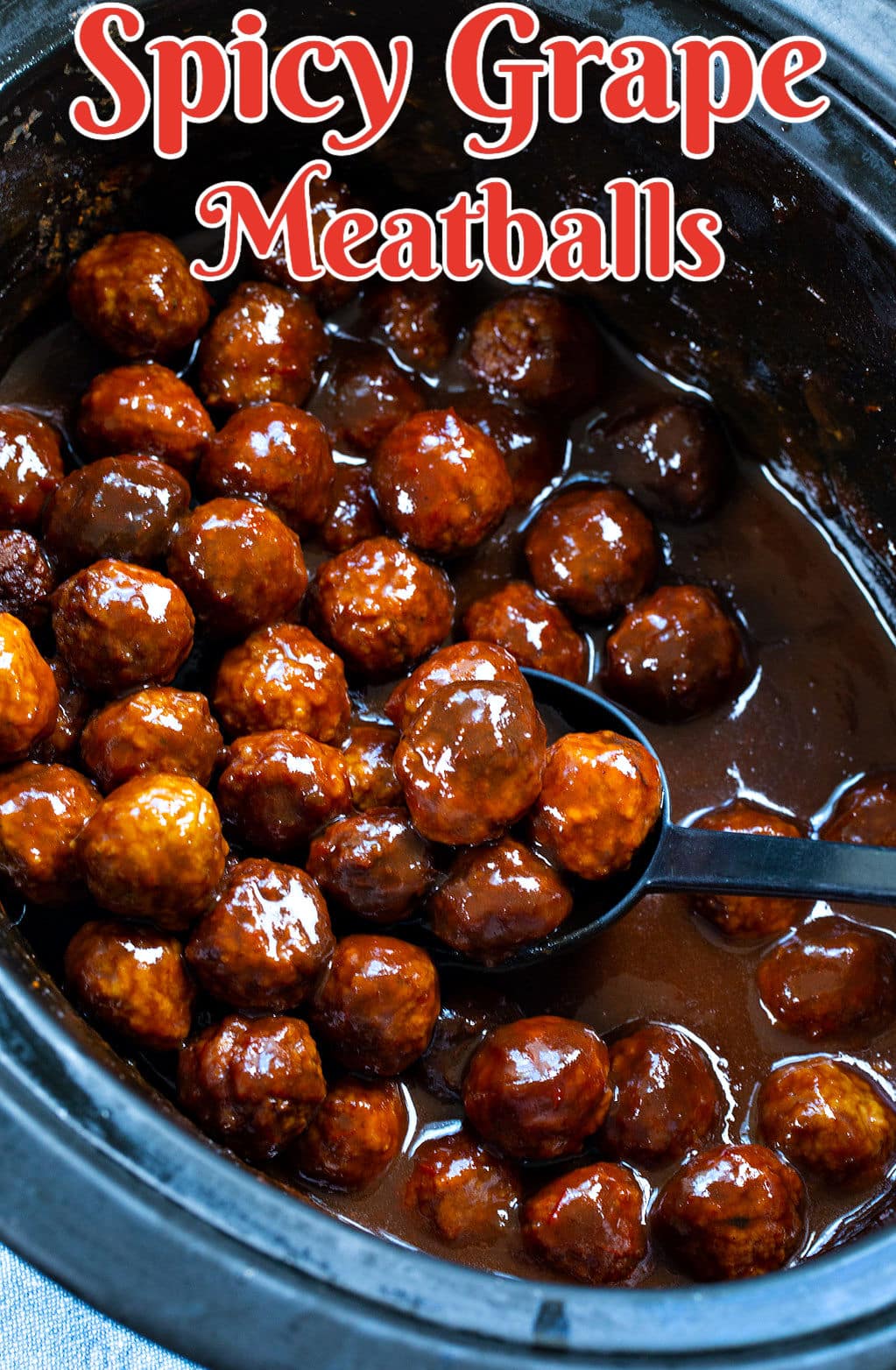 Slow Cooker Spicy Grape Meatballs in crock pot.