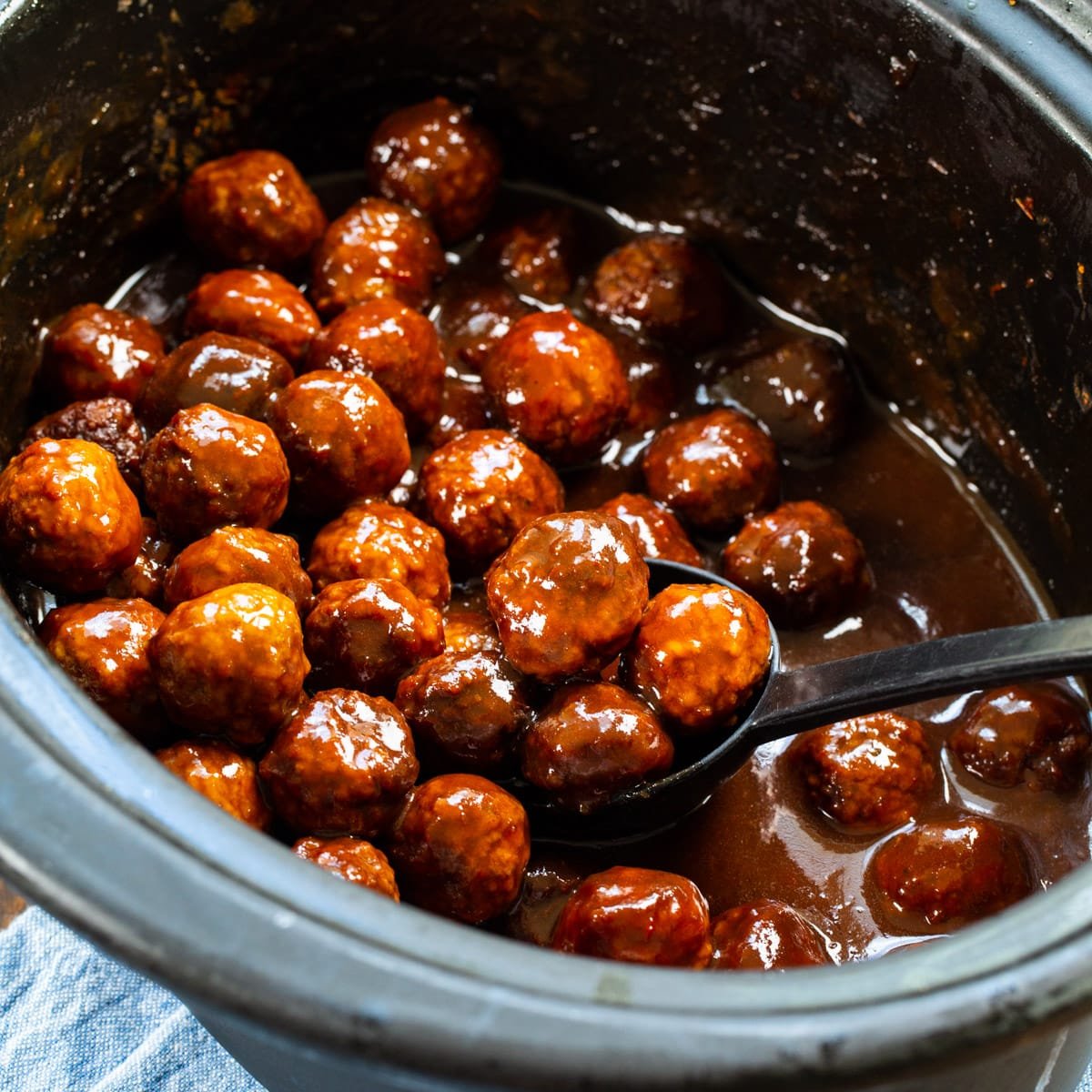 Spicy Grape Meatballs in slow cooker.