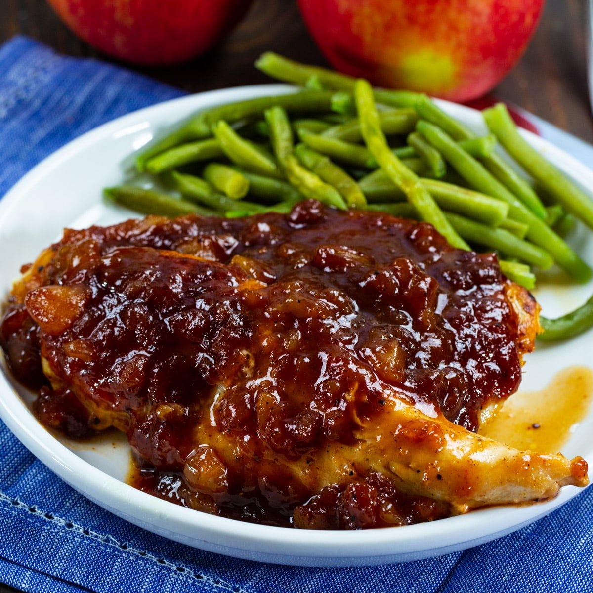 Applesauce BBQ Chicken on a plate with green beans.