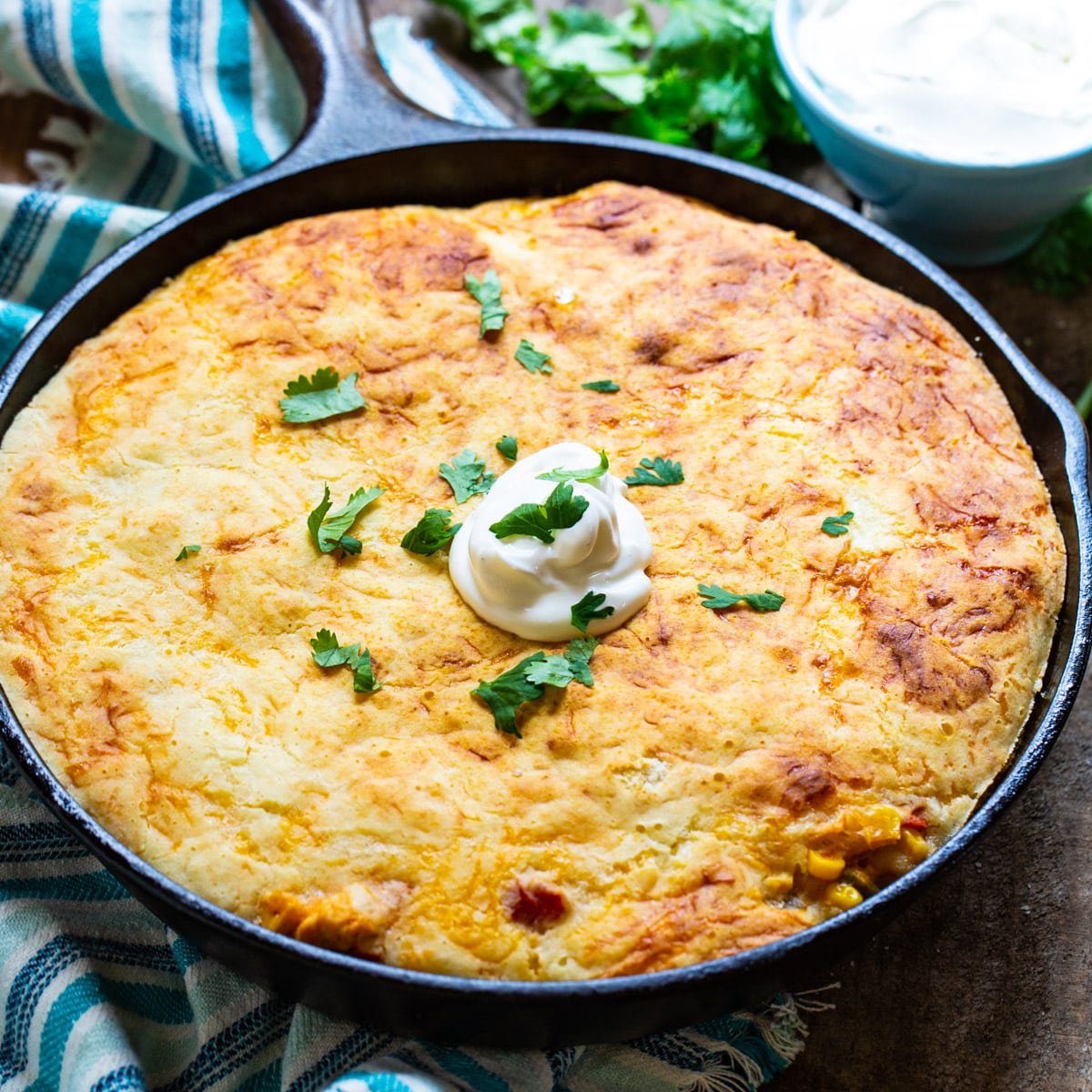 Mexican Chicken Cornbread Casserole in a cast iron pan.