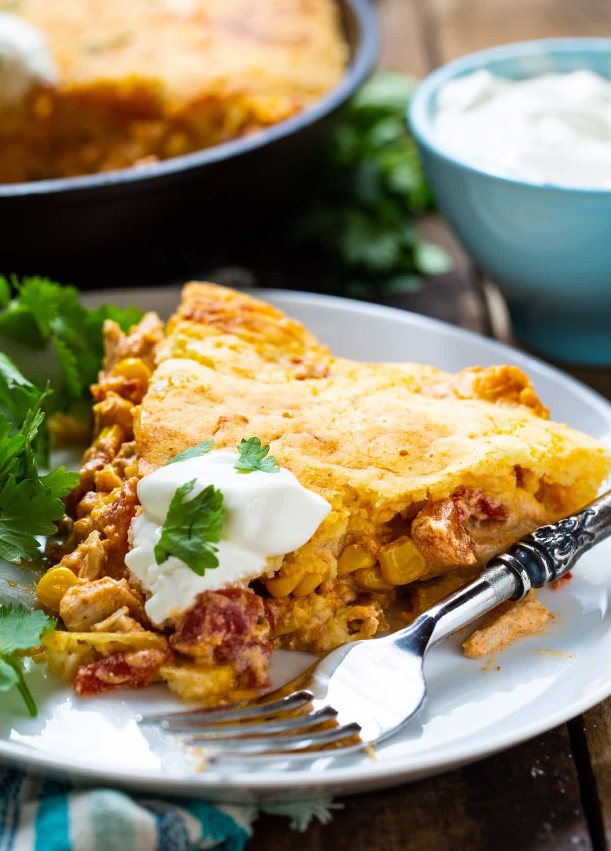 Slice of cornbread casserole on a plate.