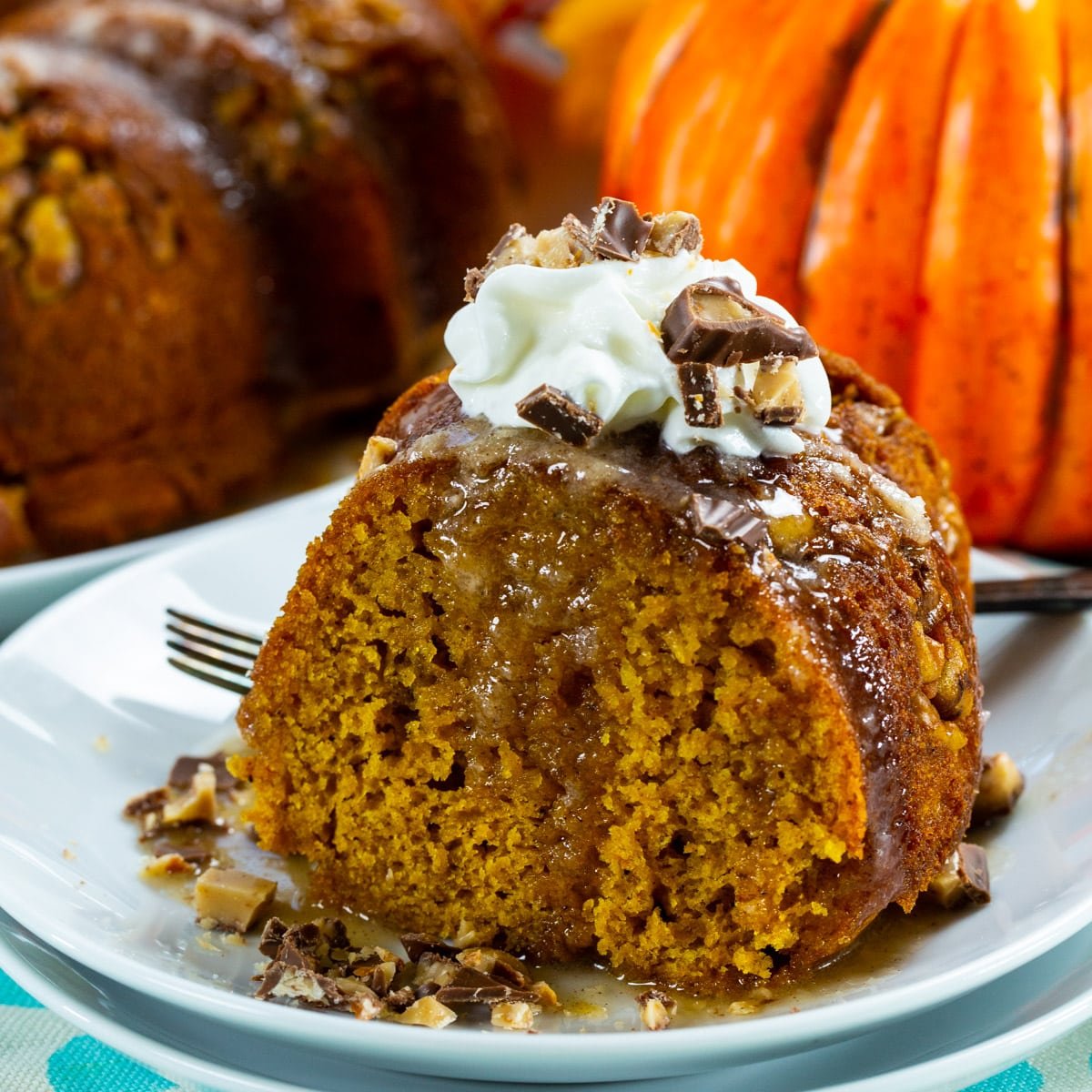 Slice of Pumpkin Cake with Rum Glaze on a plate.