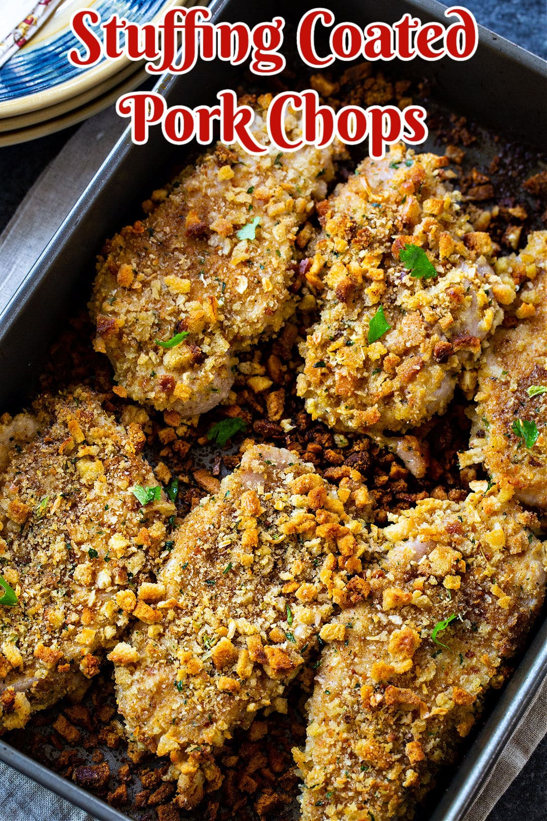 Stuffing Coated Pork Chops in baking dish.