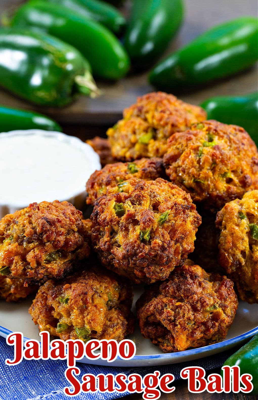 Jalapeno Sausage Balls on a plate with dipping sauce.