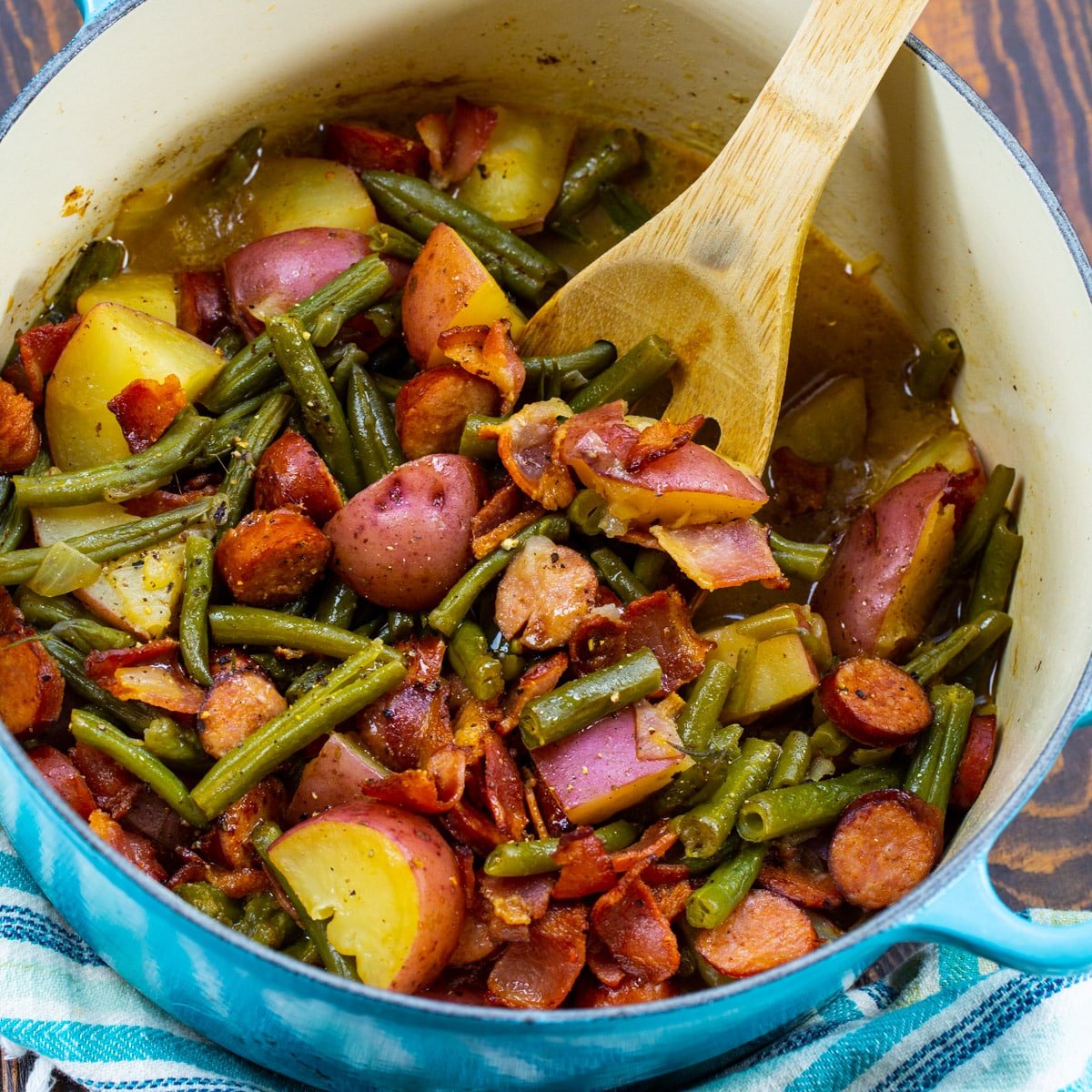 Smothered Cajun Green Beans in a Dutch oven.