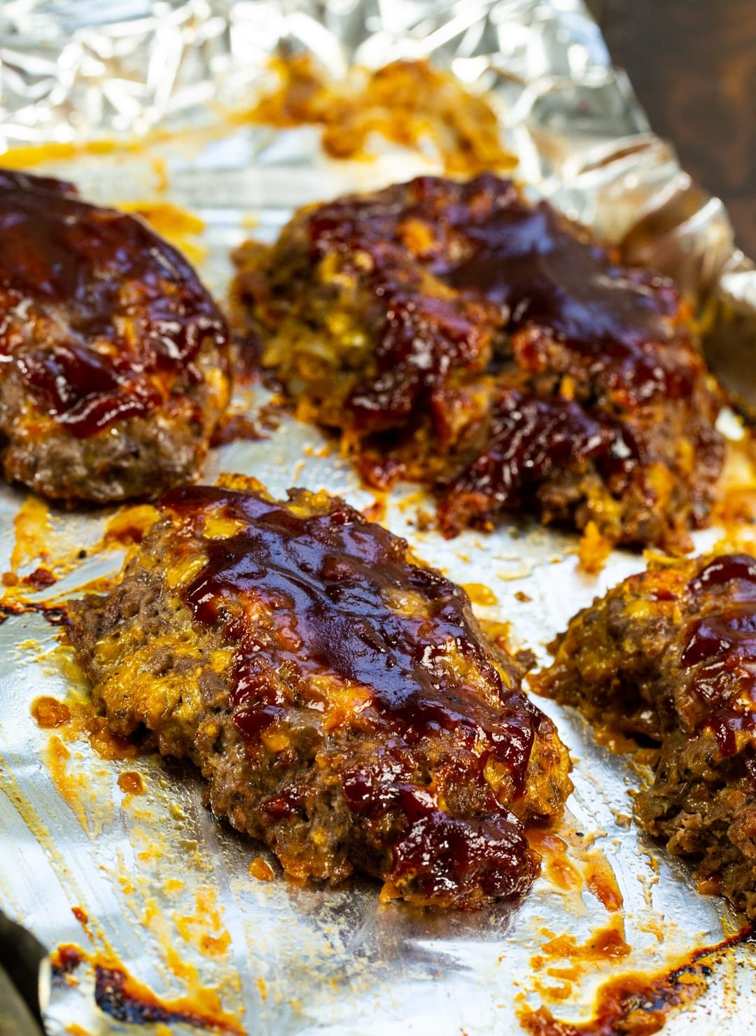 Mini BBQ Cheddar Meatloaves on baking sheet.
