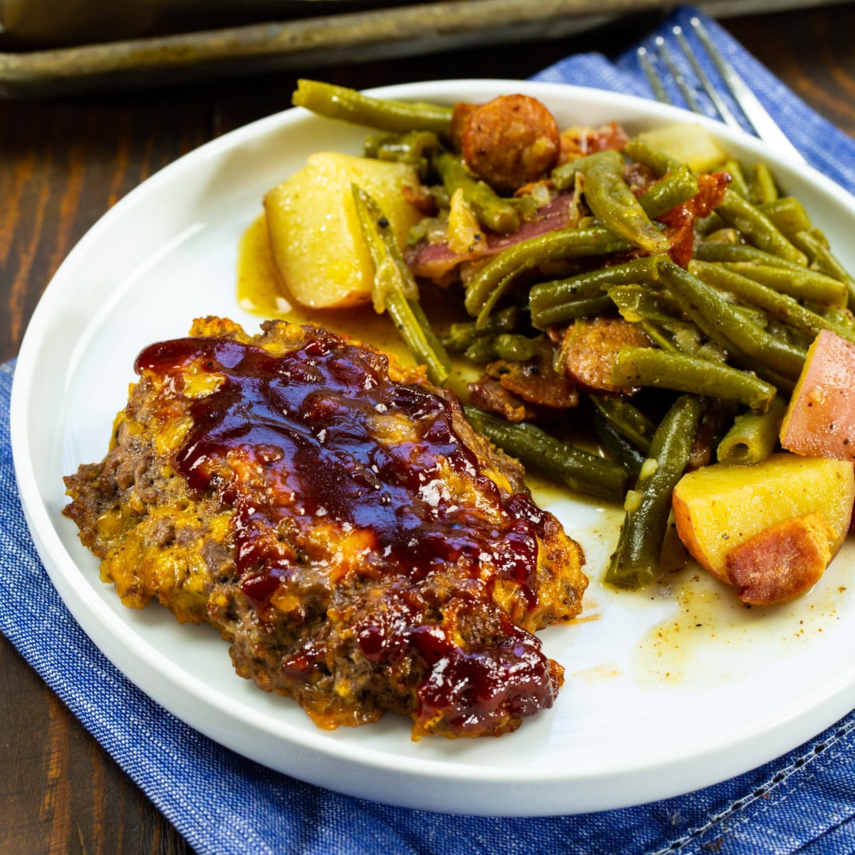 Mini BBQ Cheddar Meatloaf on plate with green beans.