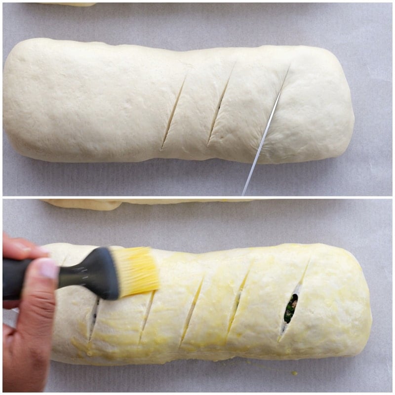 Cutting slits in bread and brushing with egg.