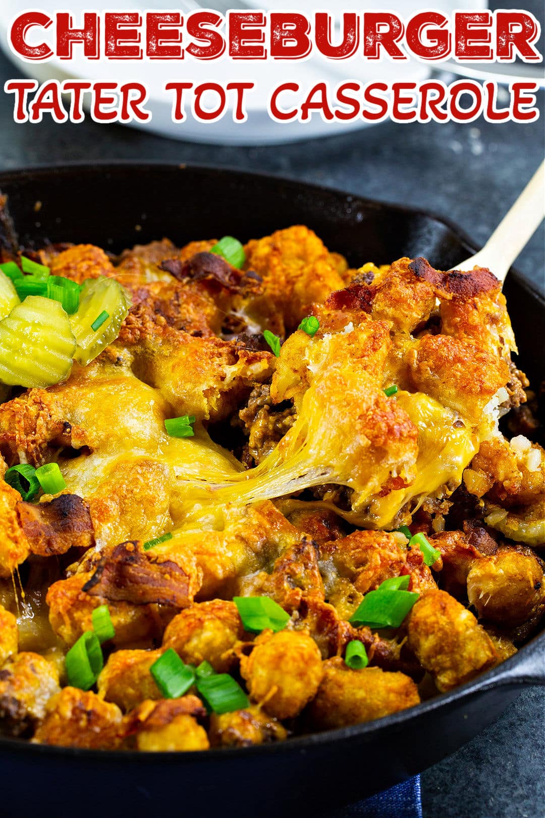 Spoon scooping up Cheeseburger Tater Tot Casserole.