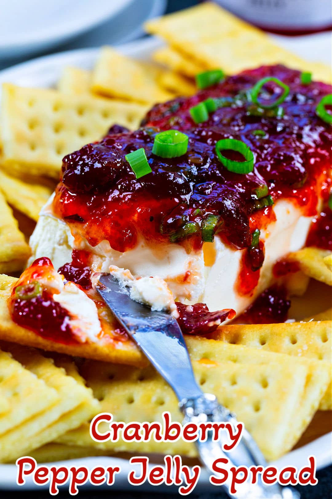 Cranberry Pepper Jelly Spread on plate with crackers.