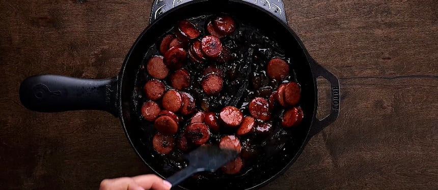 Coating sausage with glaze.