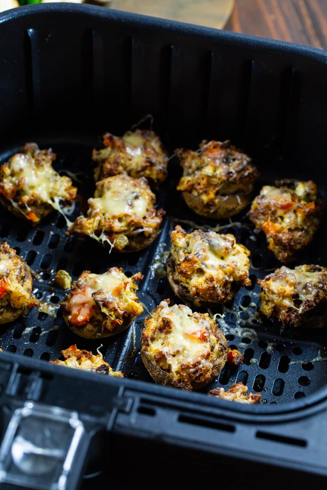 Stuffed Mushrooms in air fryer basket.