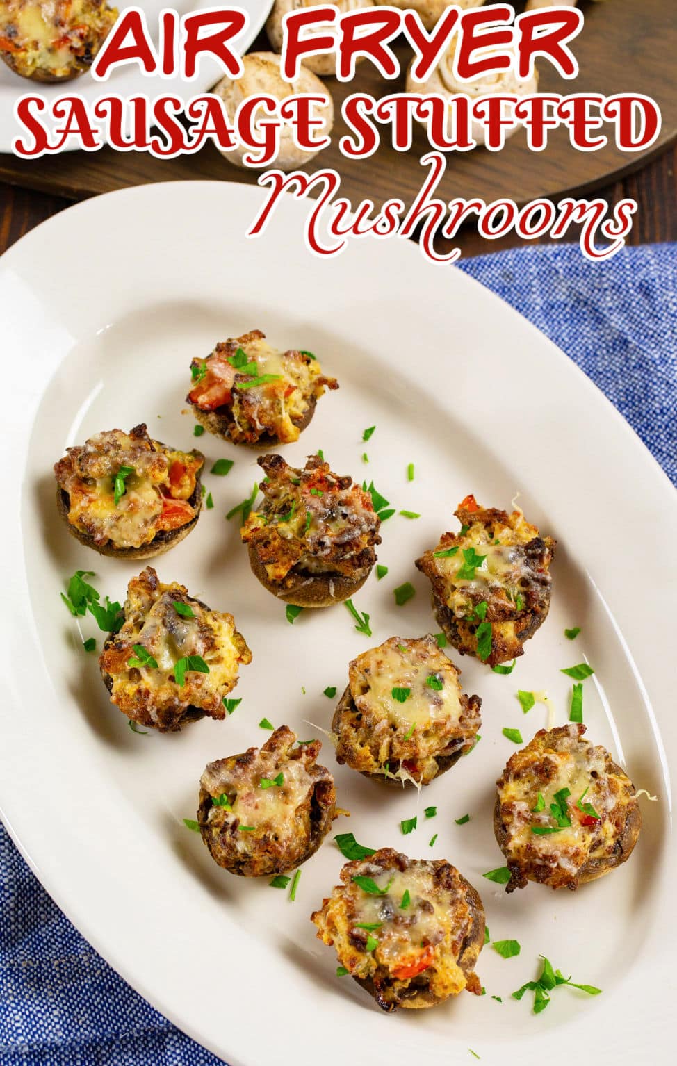 Air Fryer Sausage Stuffed Mushrooms on a serving plate.