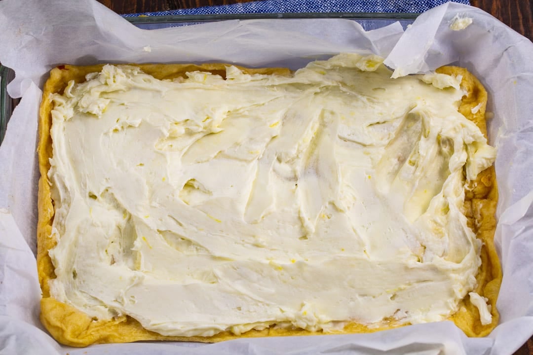 Cream cheese mixture spread on bottom crust.