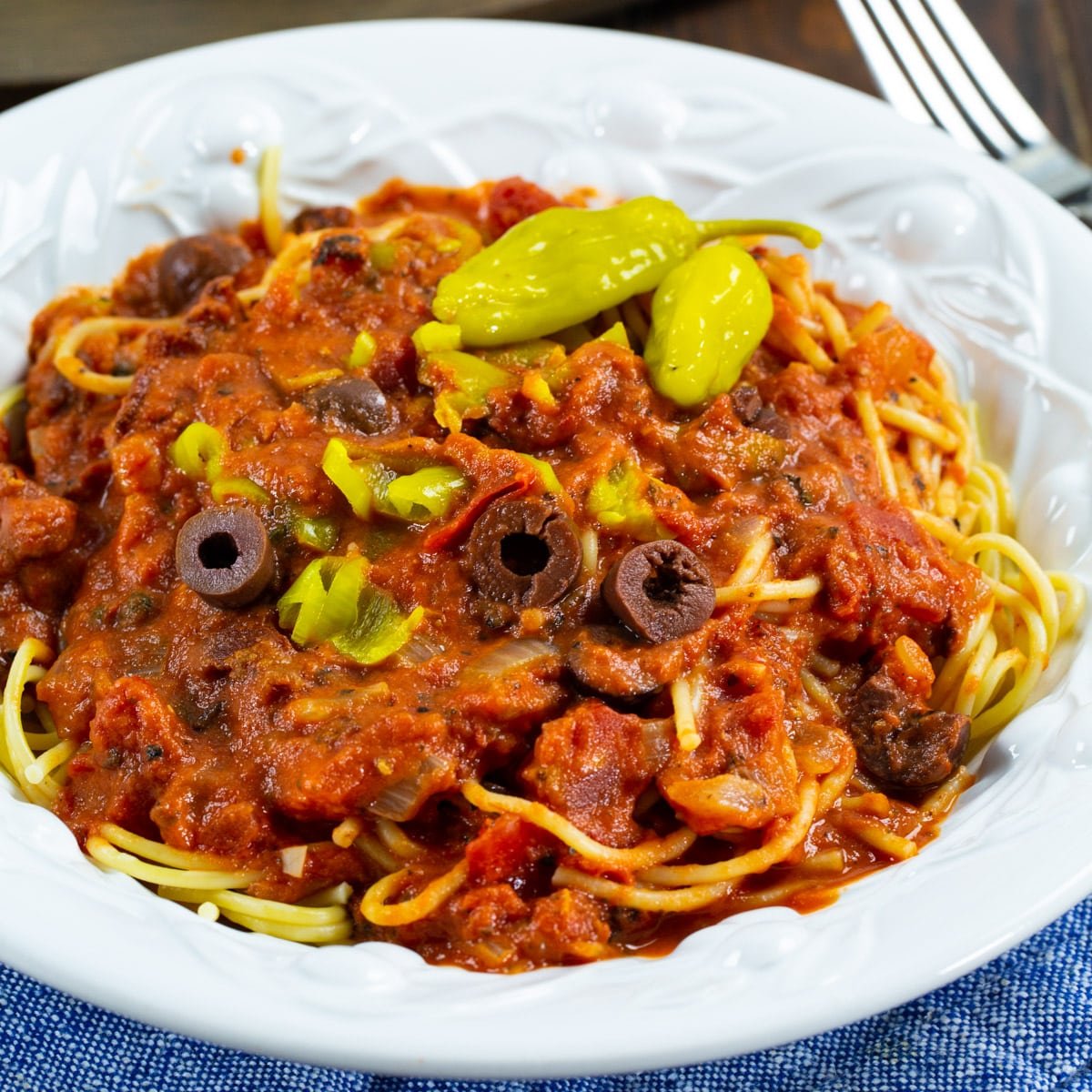 Pepperoncini Pasta Sauce over spaghetti in a bowl.