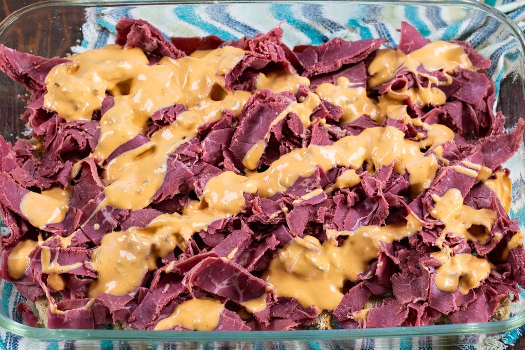 Thousand Island drizzled over corned beef.