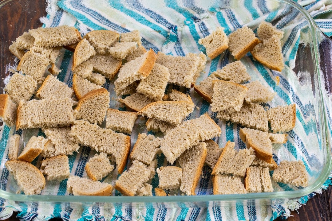 Bread cubes in baking dish.
