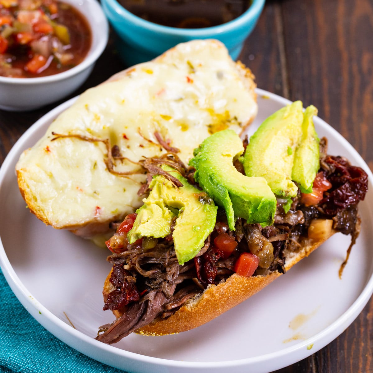 Slow Cooker Mexican Dip Sandwich on a plate.