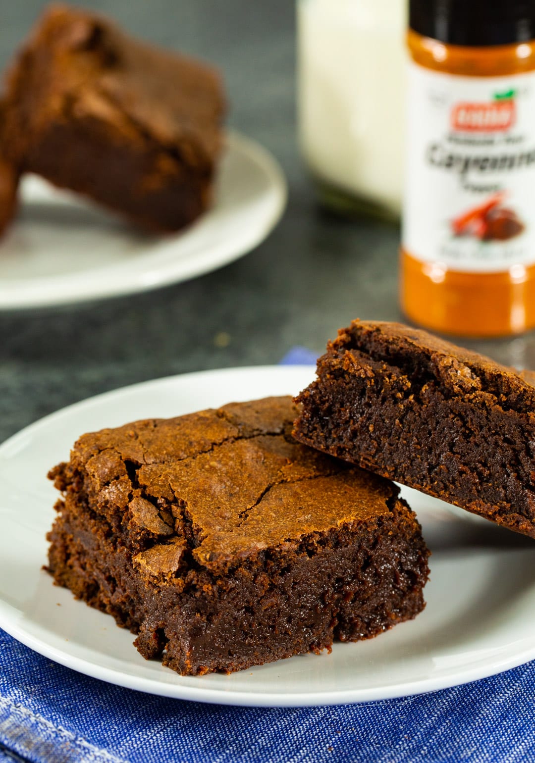 Two brownies on a plate.
