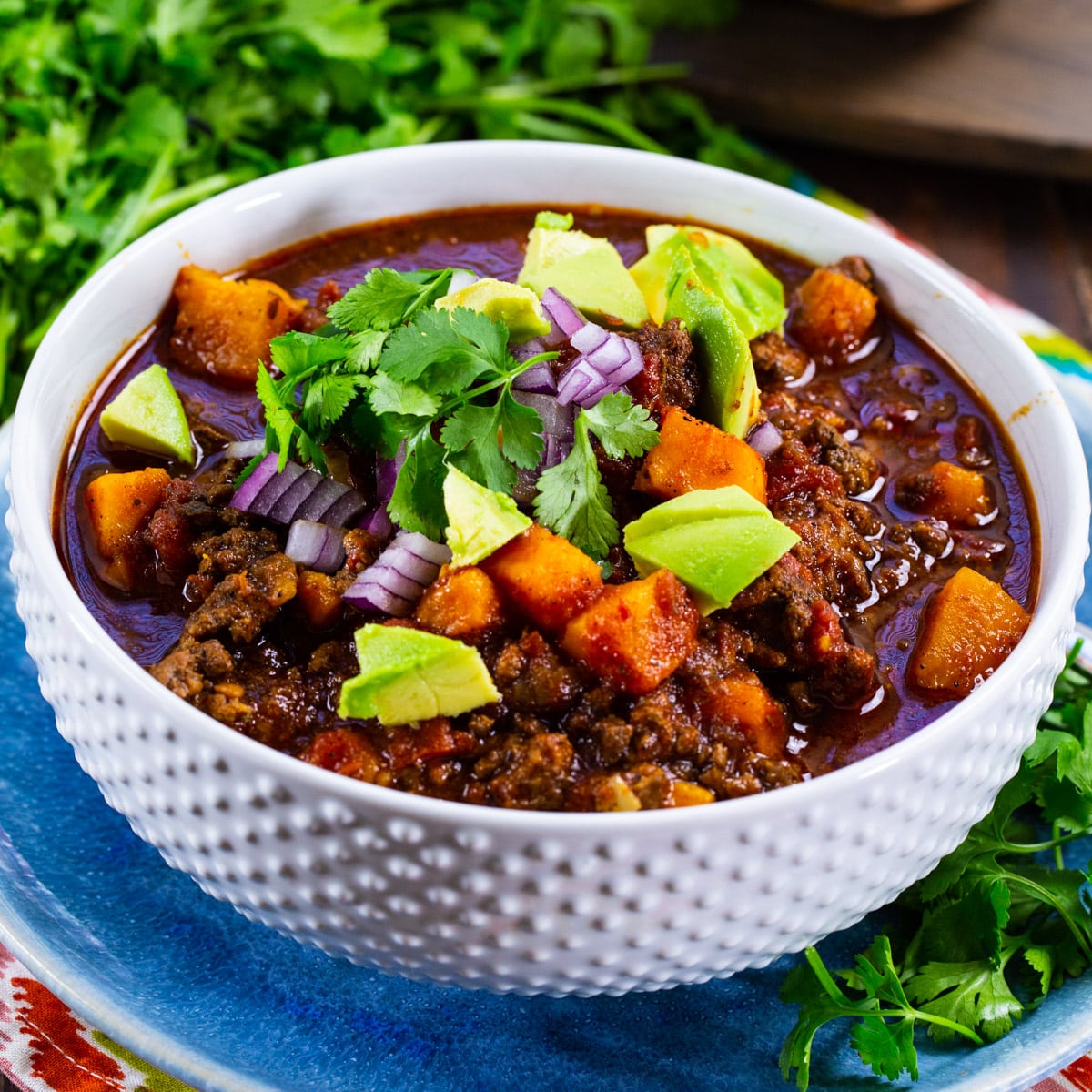 Slow Cooker Beef and Sweet Potato Chili in a white bowl.