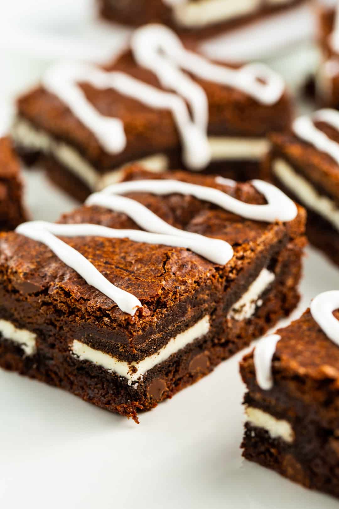 Oreo Brownies arranged on a plate.