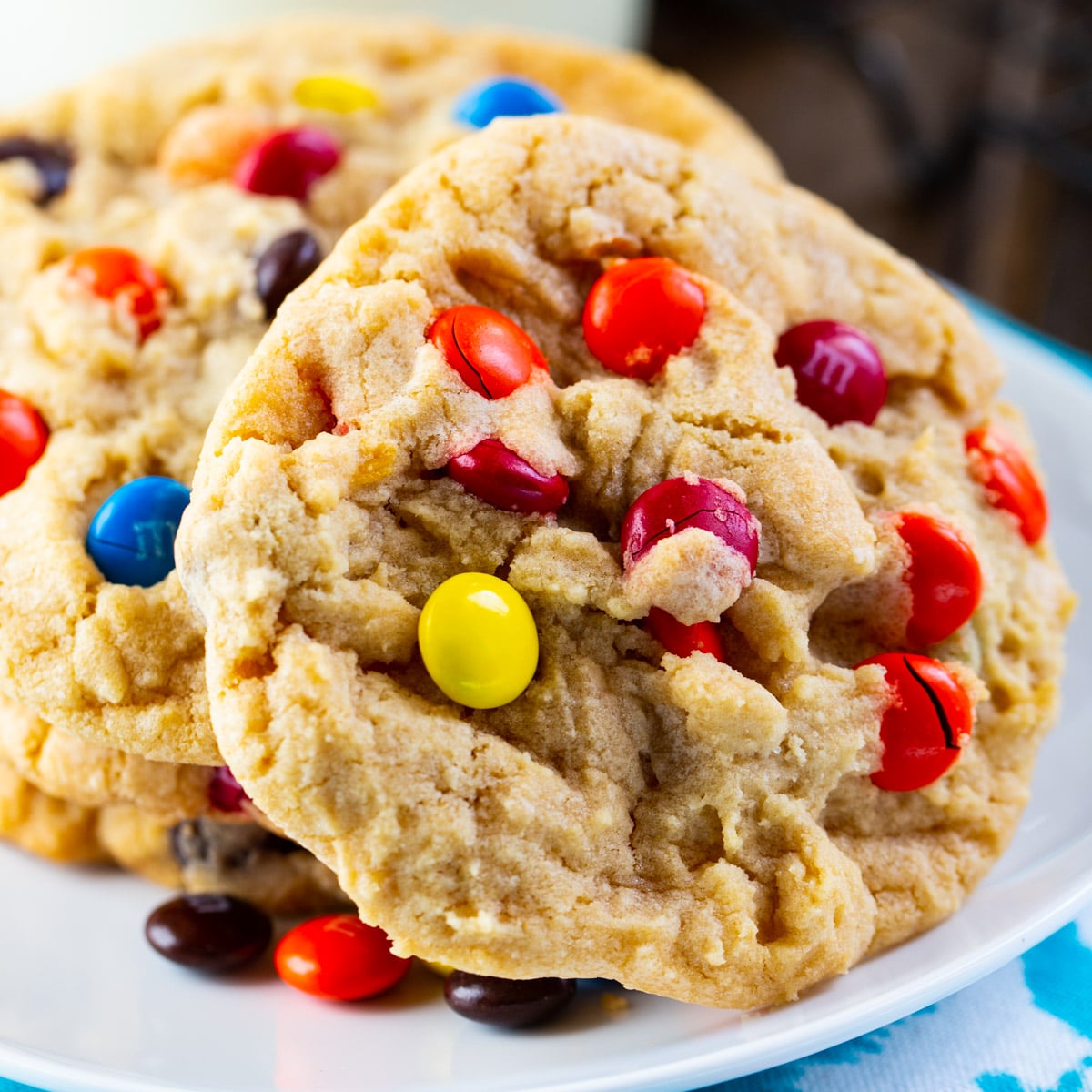Soft and Chewy M&M Cookies on a plate.