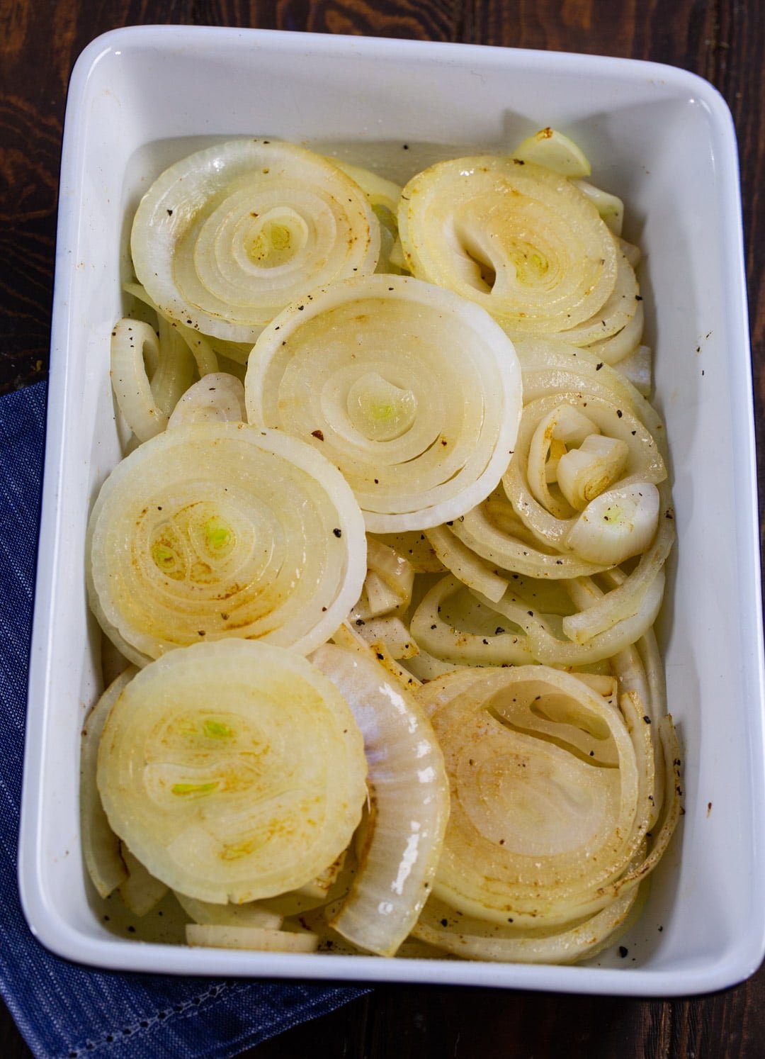 Cooked onions in baking dish.