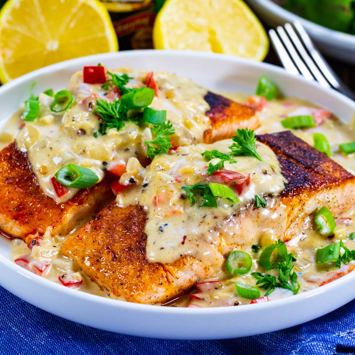 Cajun Salmon with Creamy Parmesan Sauce on a plate.