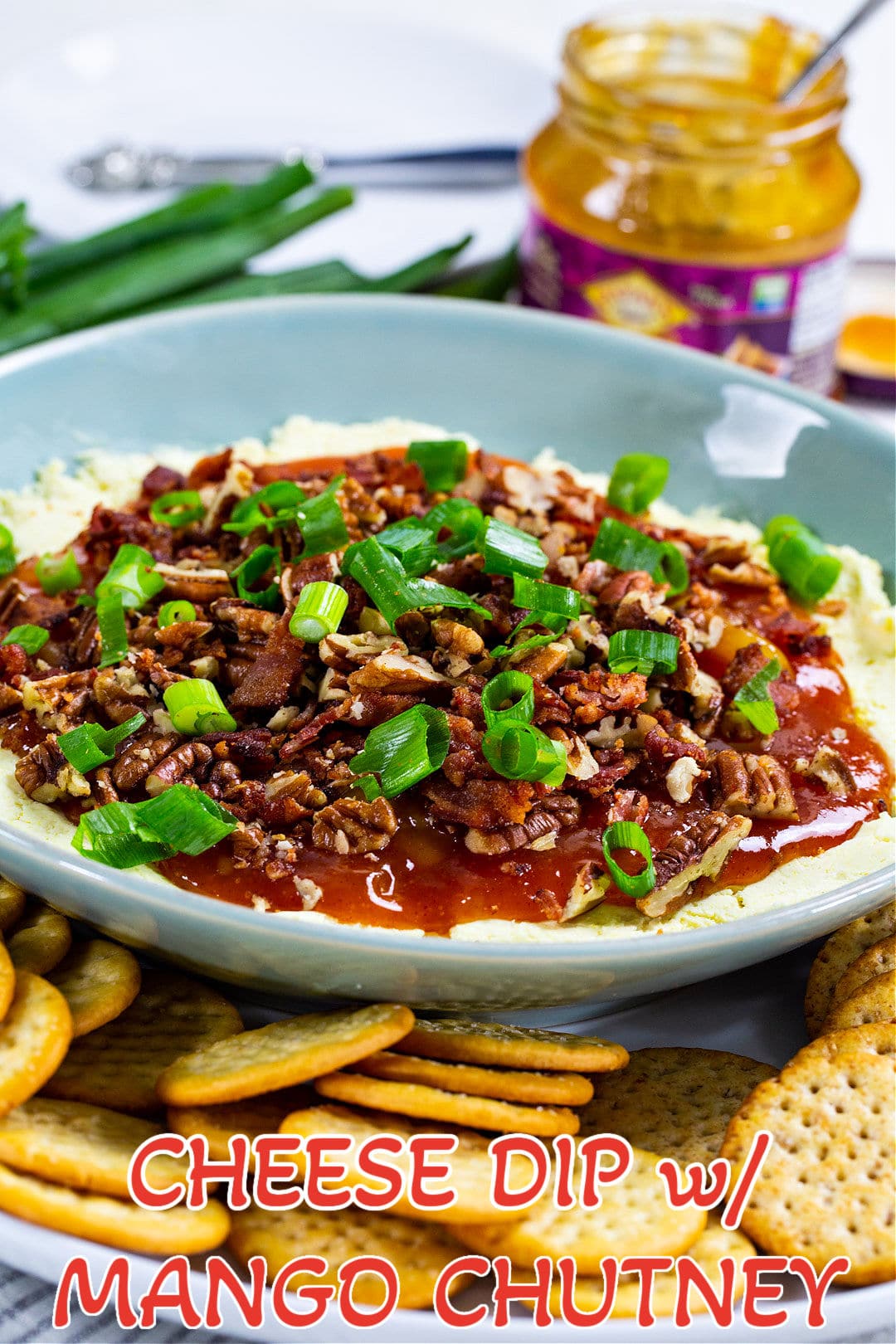 Cheese Dip with Mango Chutney in a blue bowl.