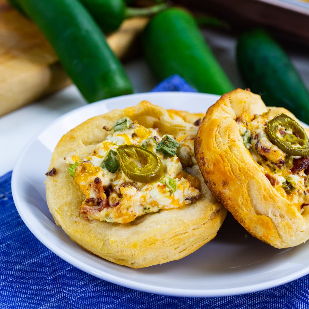 Two Jalapeno Popper Biscuit Rounds on a plate.