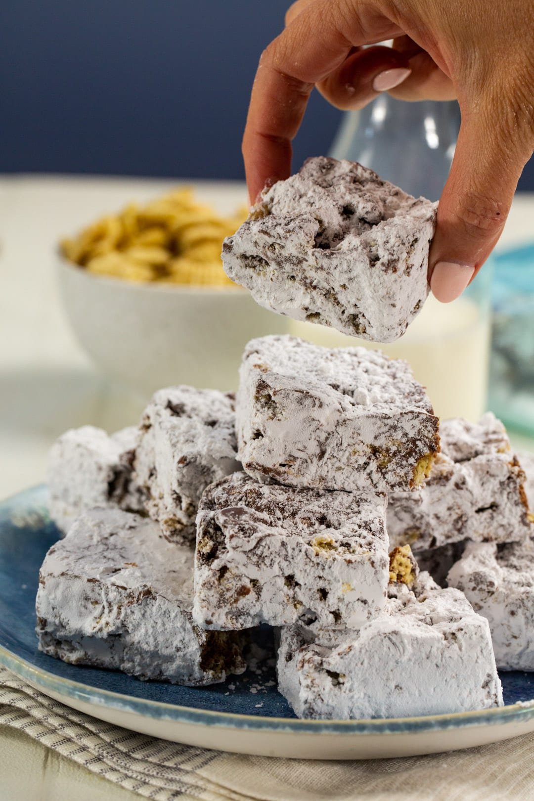 Hand picking up a Muddy Buddy Bar.