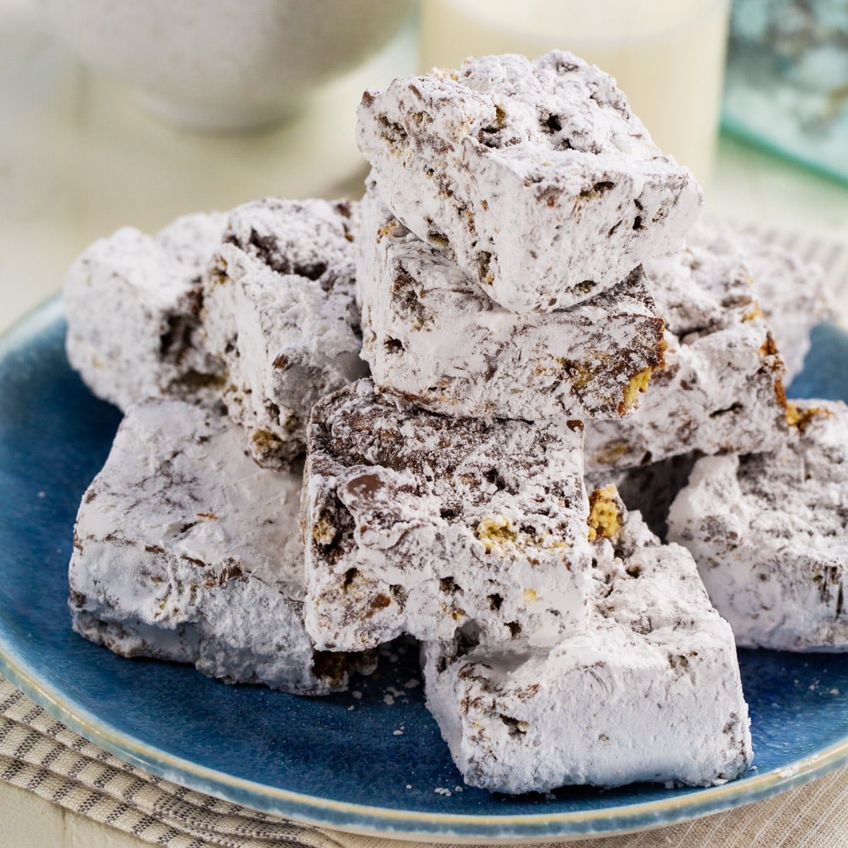 Muddy Buddy Bars stacked up on a plate.