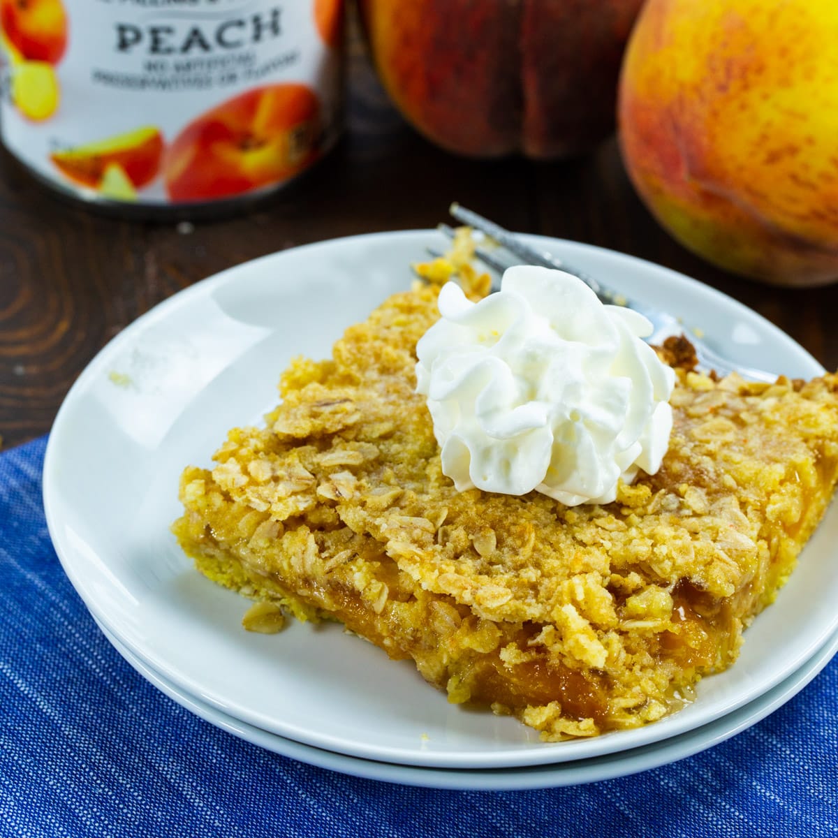 Peach Bar topped with whipped cream.