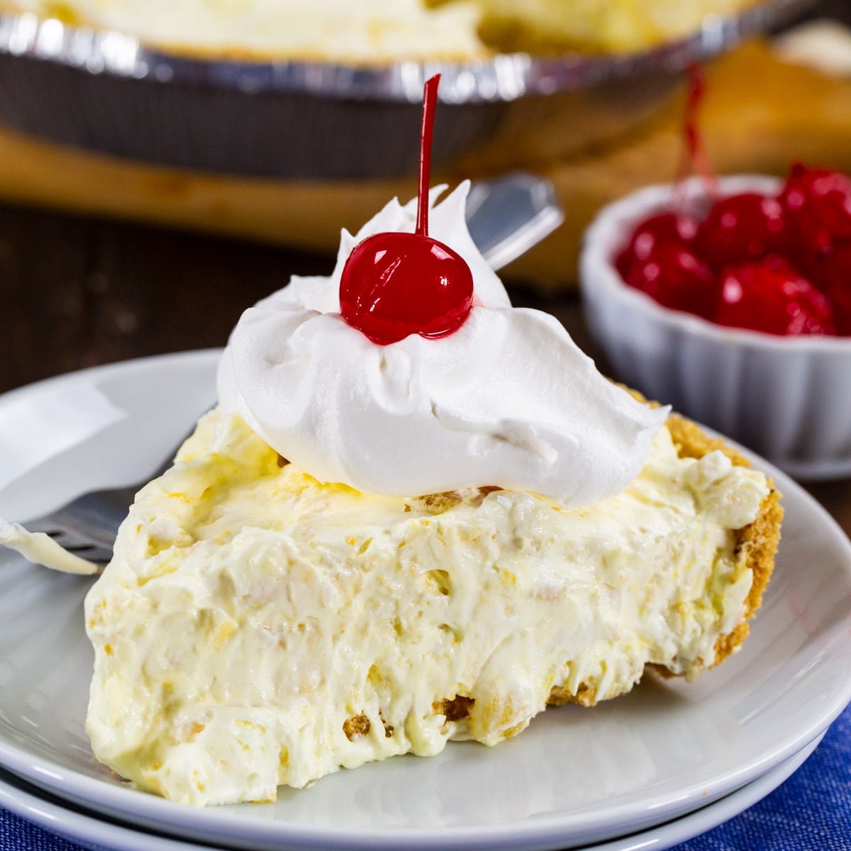 Slice of Pineapple Fluff Pie on a plate.