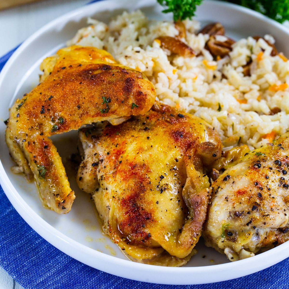 Southern Baked Chicken on a plate with rice.