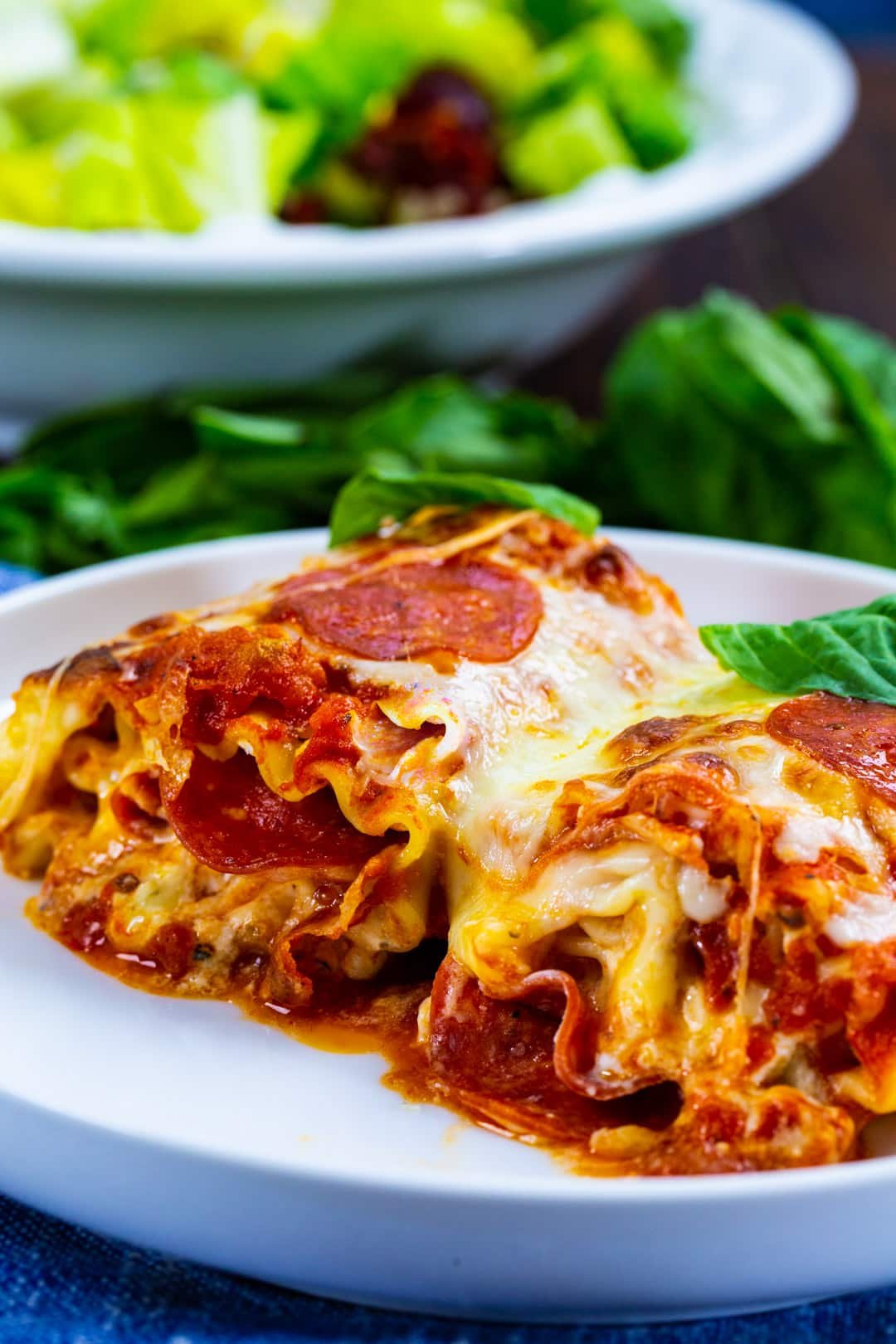 Two Lasagna Roll-Ups on a plate.